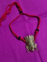 Handcrafted Dokra Tribal Face Pendant Necklace – Red Thread Design - Image 2