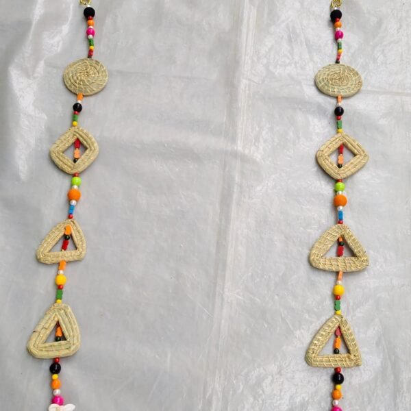 Handmade grass hanging on the side of the colorful house door decoration