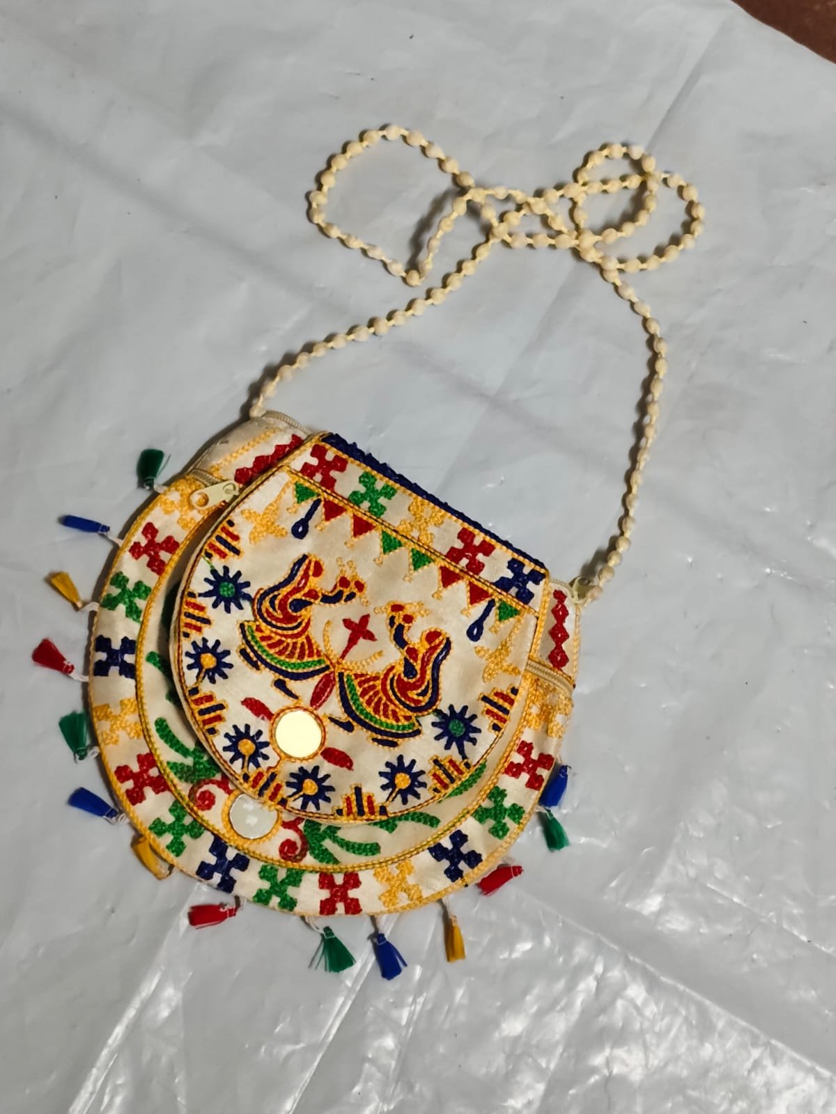 WhatsApp Image 2025-08-24 at 20.52.47_9536d746 Handcrafted Embroidered Sling Bag –  Mirror Work & Tassels - Image 3
