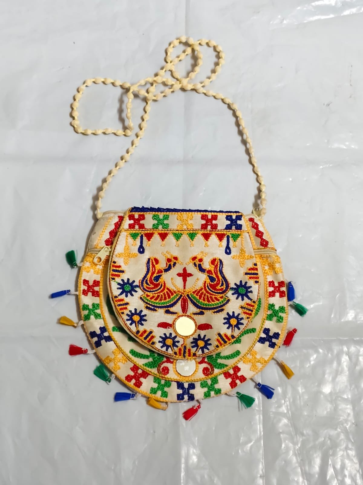 WhatsApp Image 2025-08-24 at 20.52.48_d88caac3 Handcrafted Embroidered Sling Bag –  Mirror Work & Tassels - Image 1