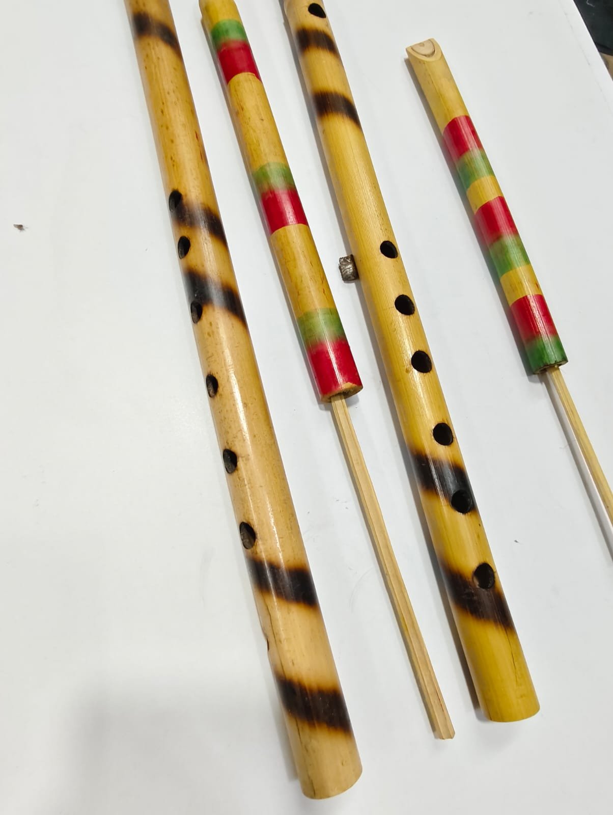 WhatsApp Image 2025-10-17 at 21.42.12_e4e965e8 Handcrafted Bamboo Flute (Bansuri) – Natural Burn Finish & Multicolor Rings | Assorted Sizes (4piece) - Image 1