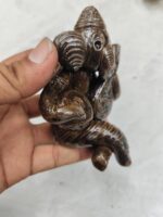 Handmade terracotta Ganesha idol – musical ensemble and Tiger's Eye. - Image 3