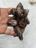 Handmade terracotta Ganesha idol – musical ensemble and Tiger's Eye. - Image 5