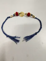 Handmade Dokra brass Rakhi – traditional festival thread (blue)