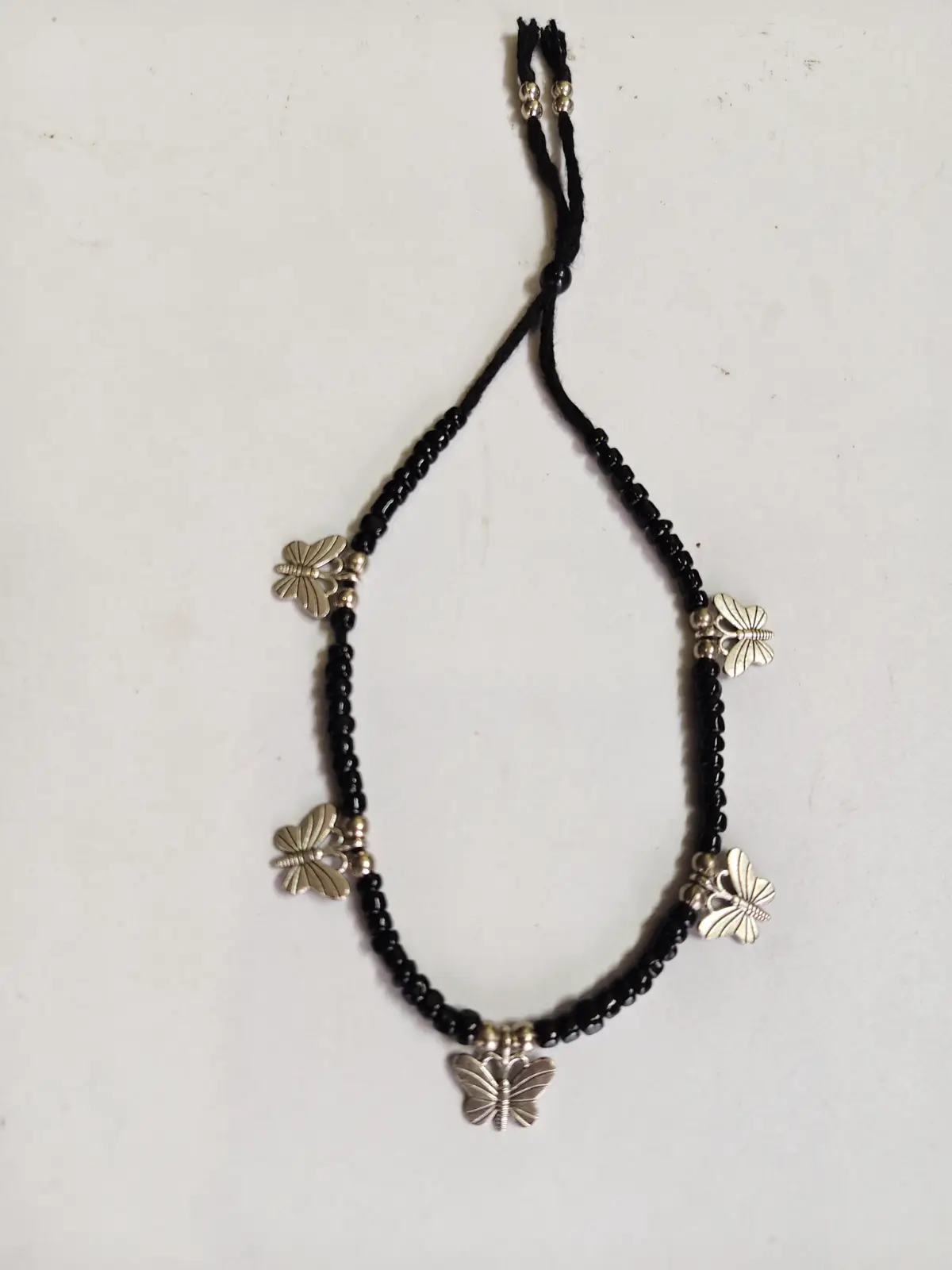 1001024289.webp Handmade Oxidized Charm Anklet – Black Beaded Design - Image 1