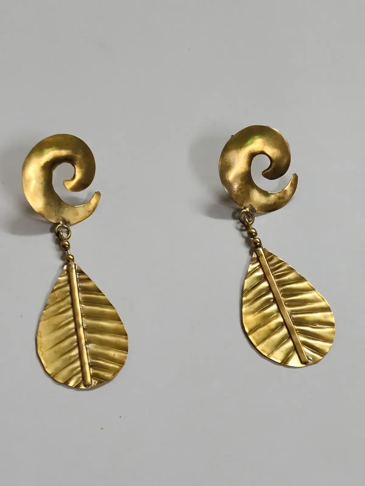 1001164171.webp Handcrafted Brass Earrings – Spiral & Leaf Motif - Image 1