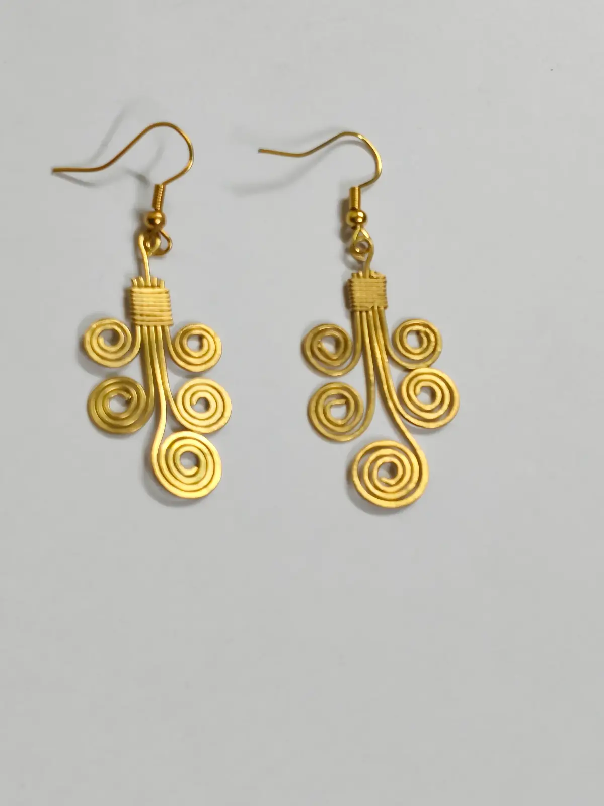 1001164198.webp Handcrafted Brass Wire Spiral Earrings – Traditional Handmade Statement Earrings - Image 1